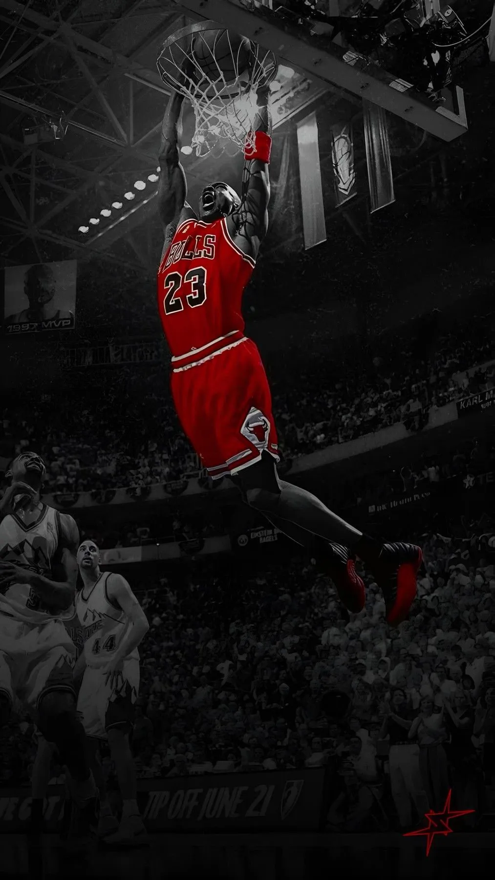 Michael Jordan in his red Chicago Bulls uniform dunking, in a black-and-white arena